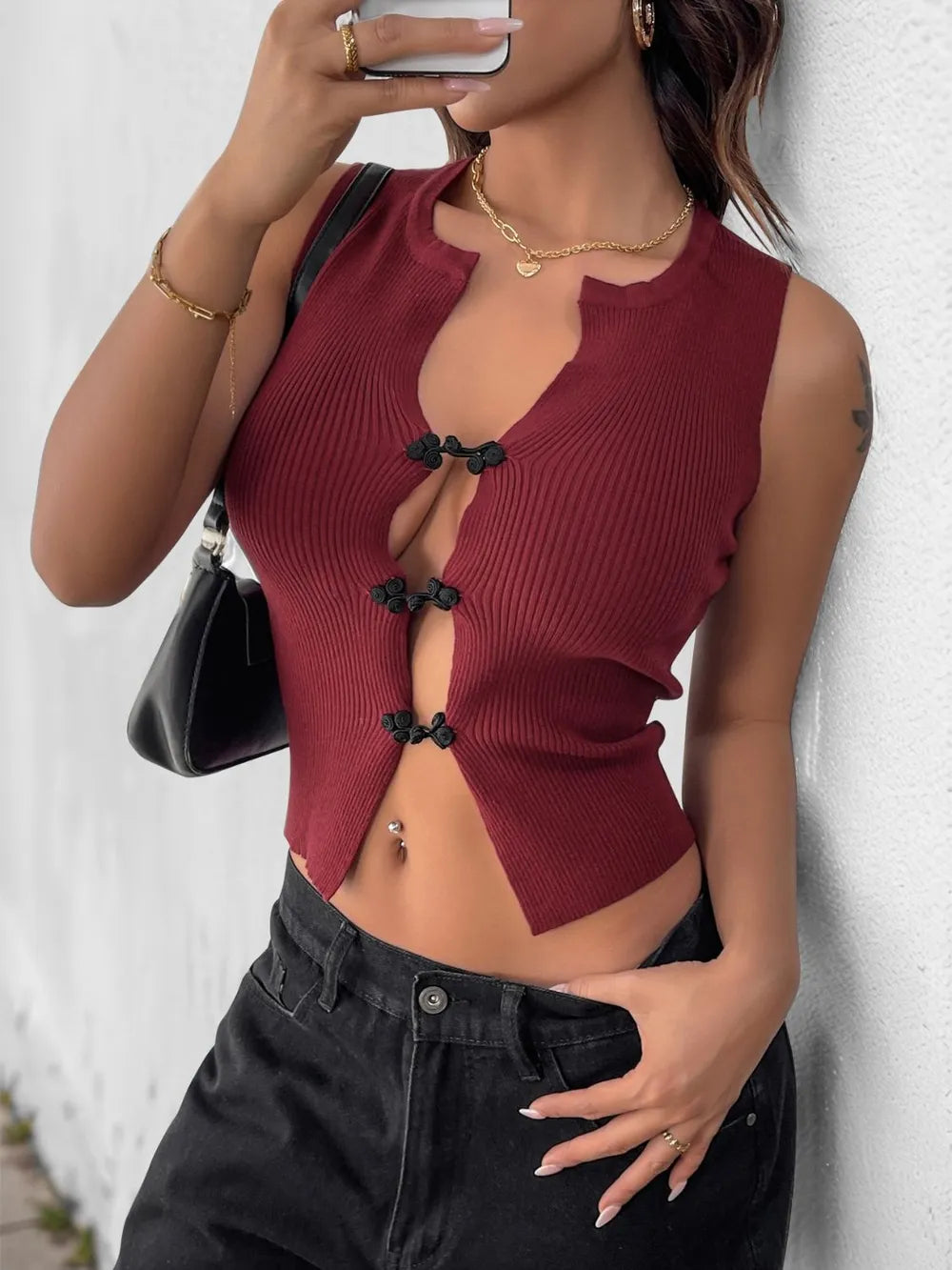 Burgundy crop tank knot button detail close up