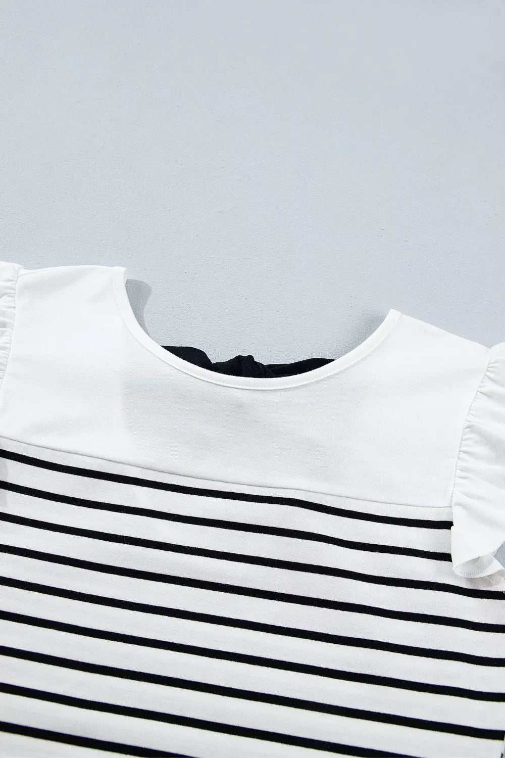 Womens striped tank top worn with a relaxed summer look