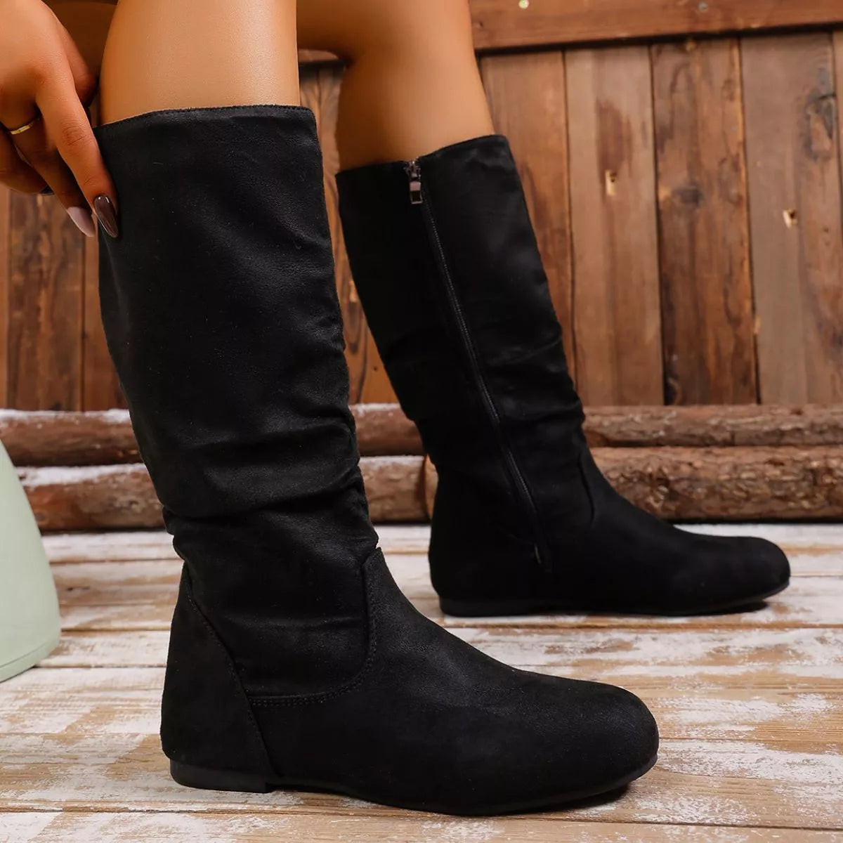 Round toe side zip boots pair standing