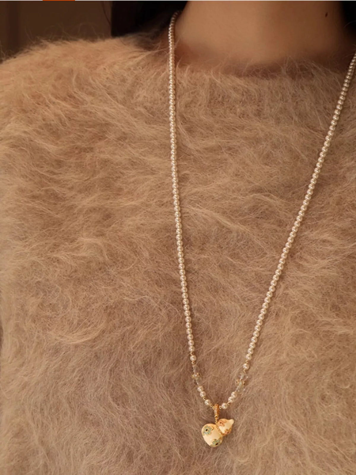 gold plated gourd pendant necklace angle view