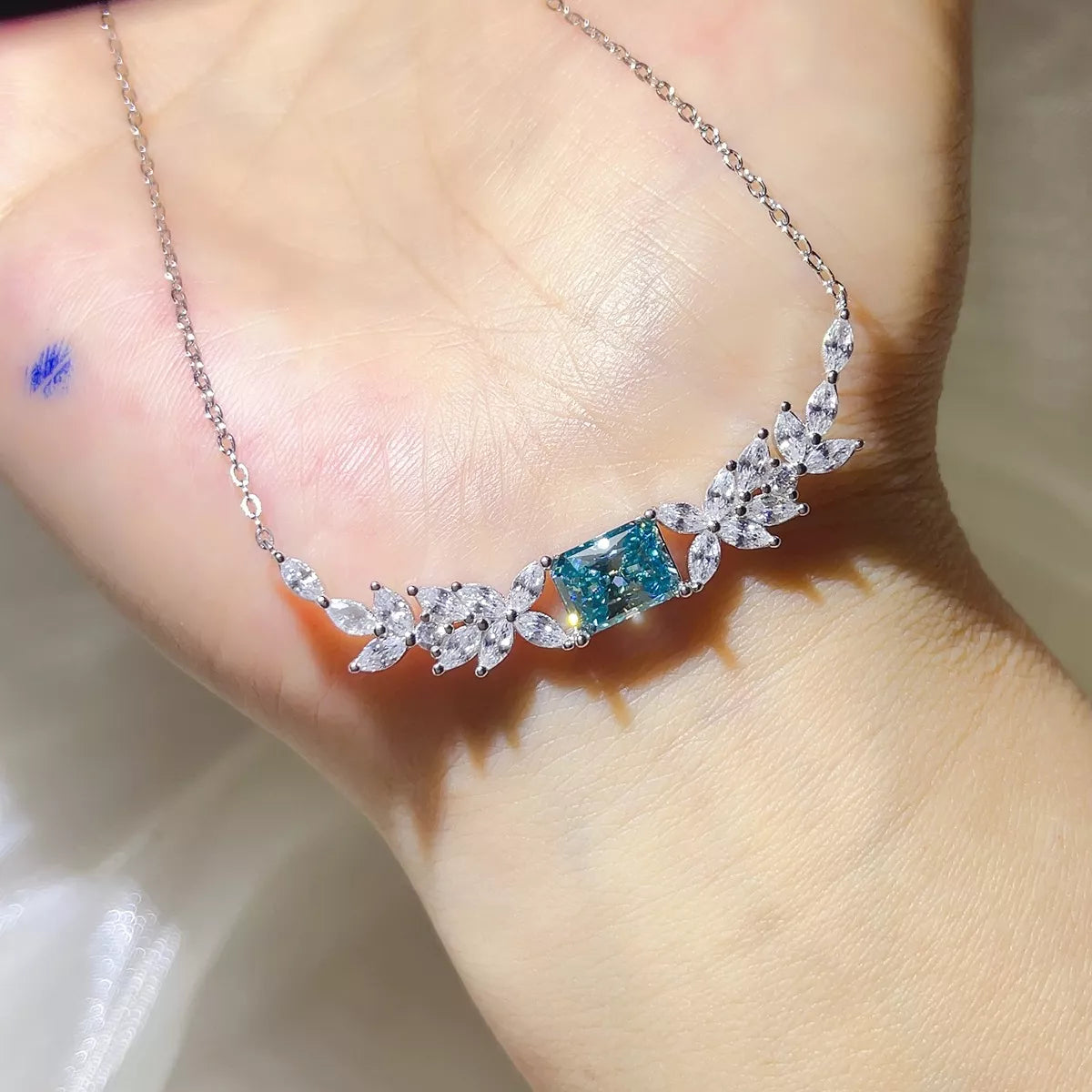 Sterling silver chain detail on moissanite necklace