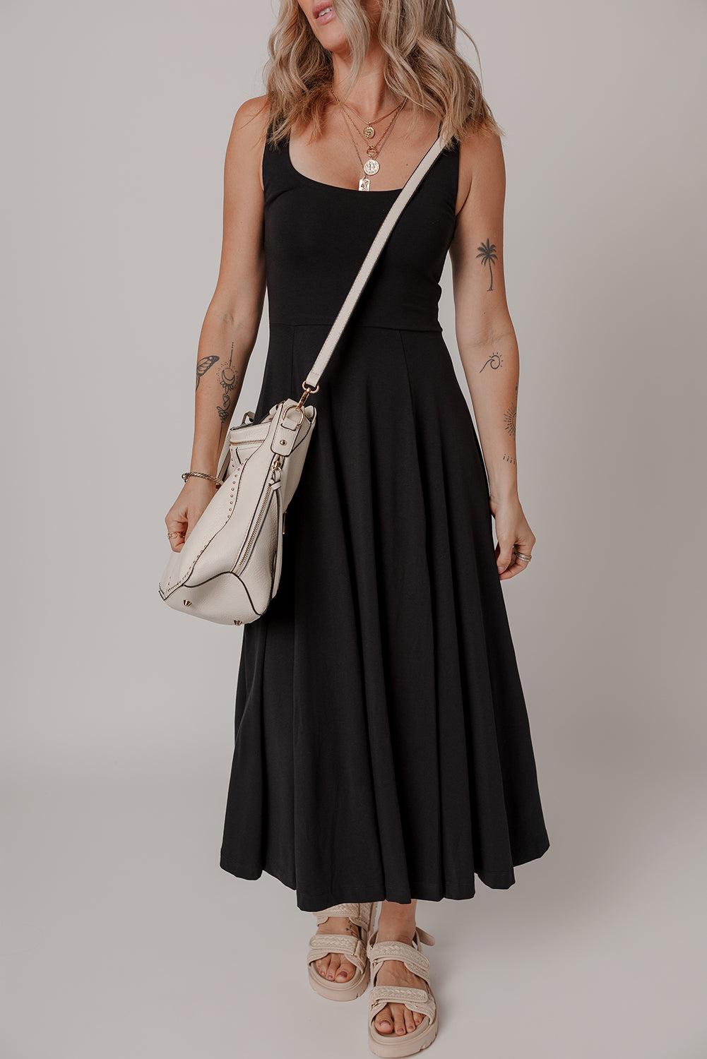 Black sleeveless midi dress close up of scoop neckline