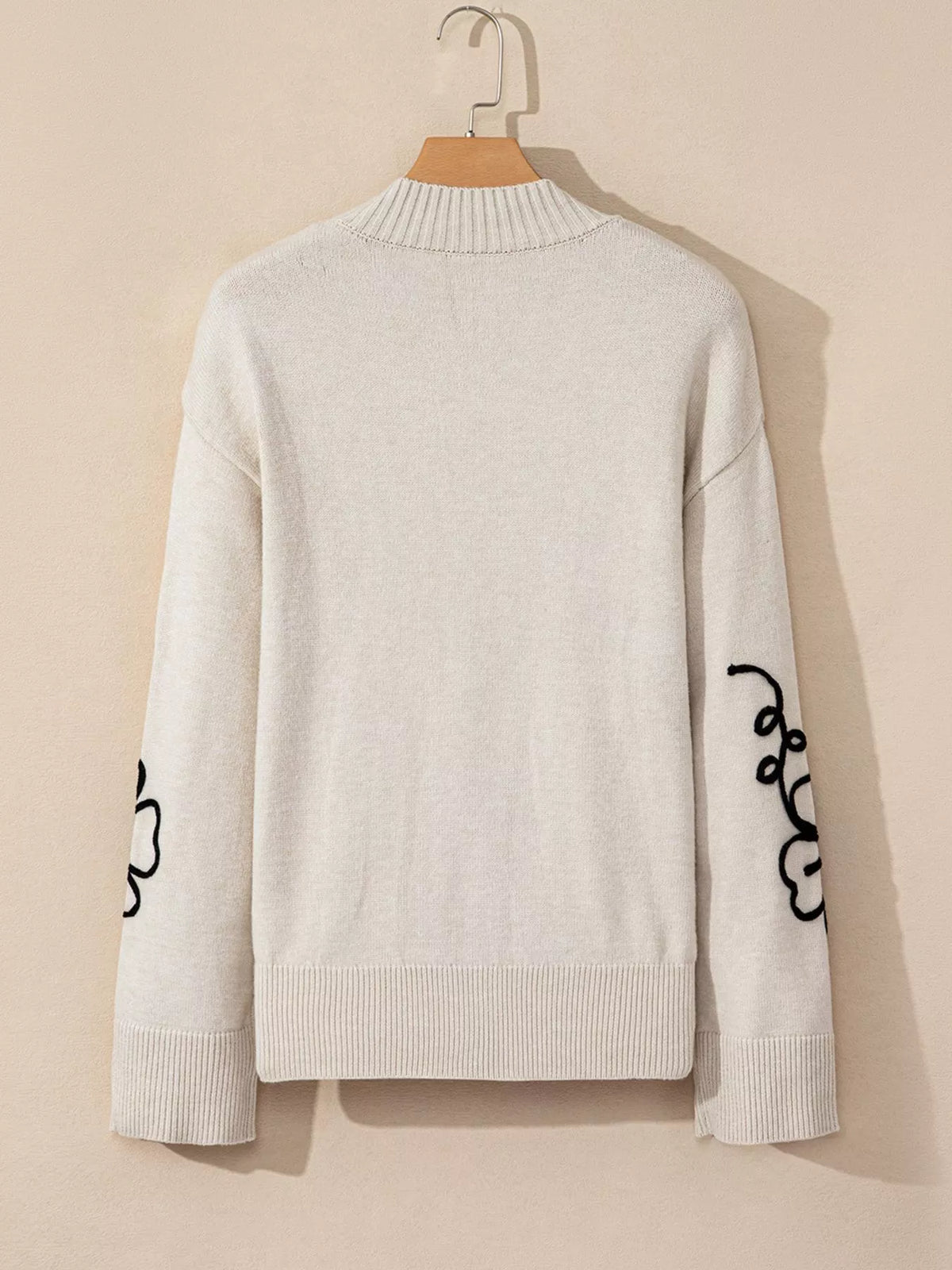 Mock neck and shoulder detail of the sweater