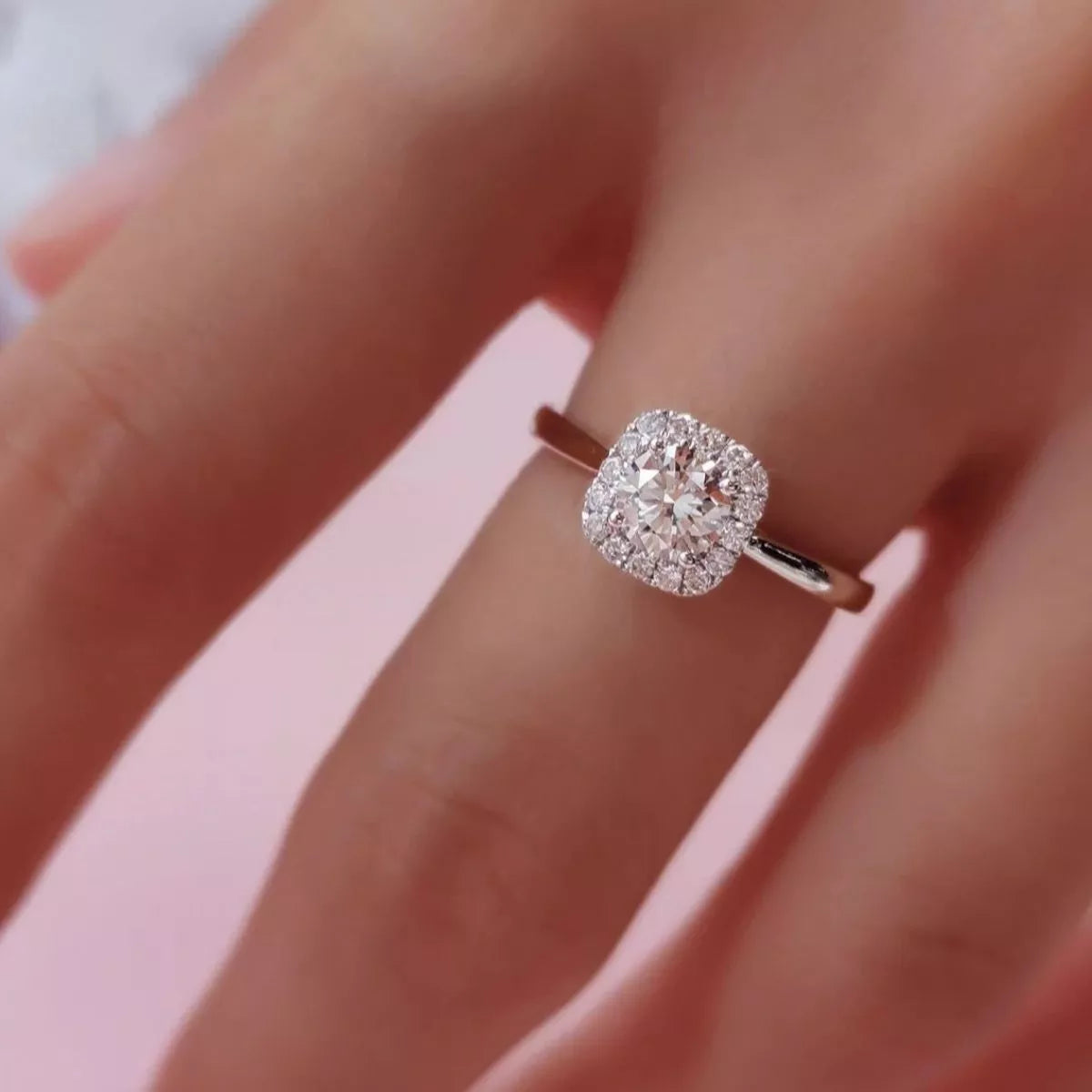 Square moissanite ring worn on the finger