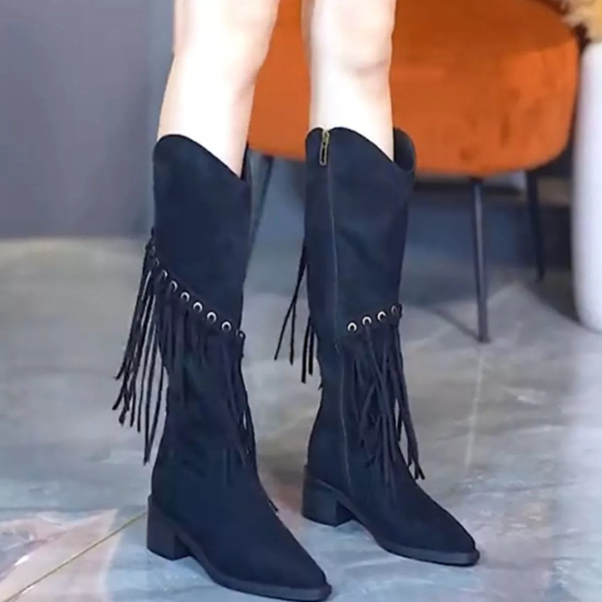 Fringed pointed toe block heel boots styled on model