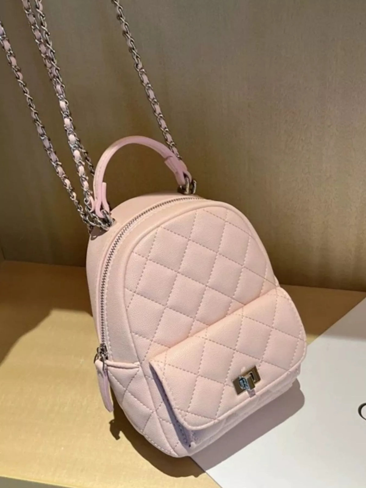 Quilted mini backpack interior compartment