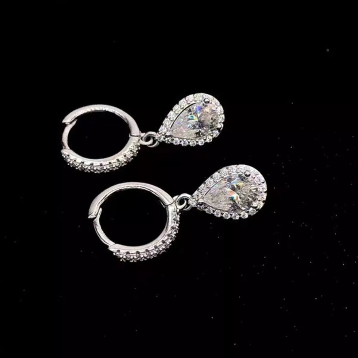 Moissanite earrings catching the light