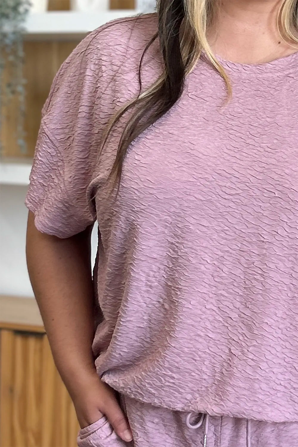 Matching top and pants set angled view on model