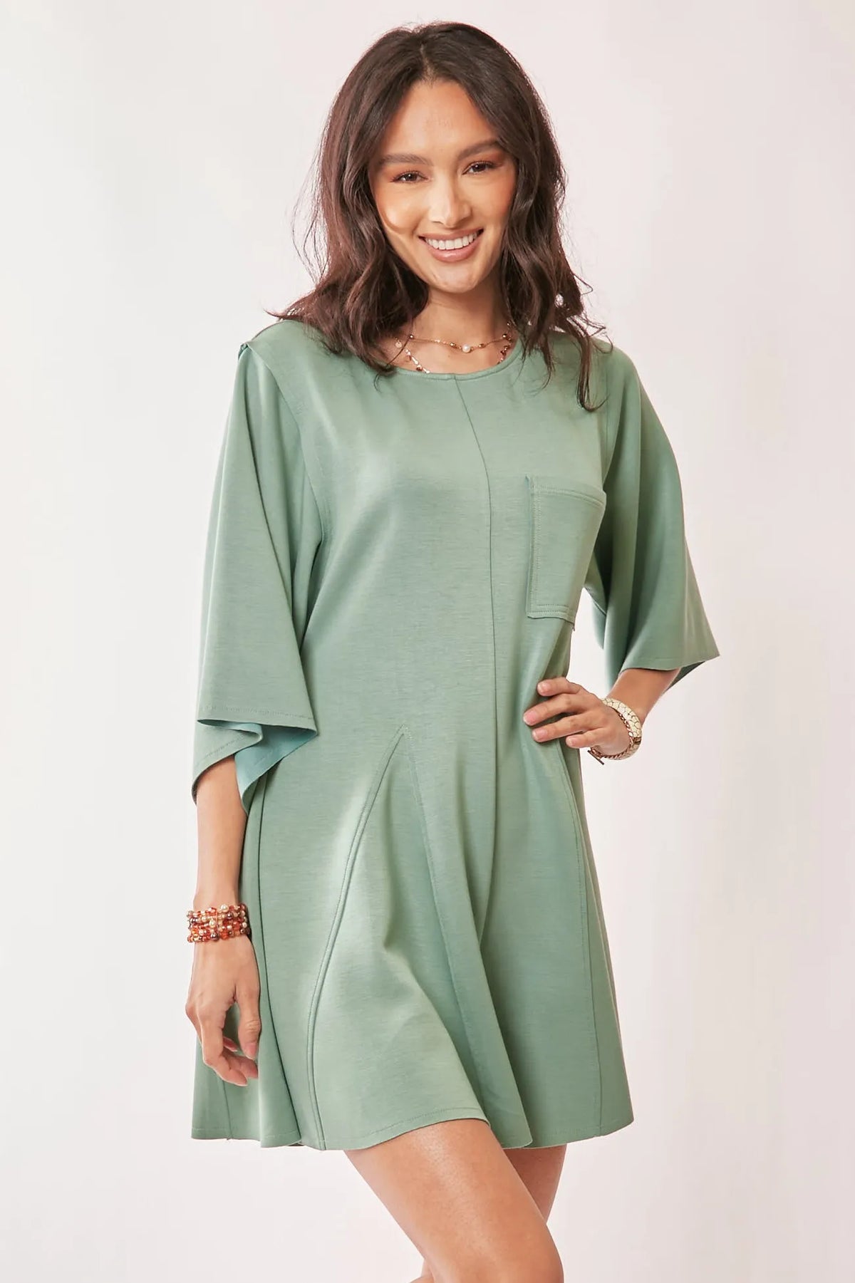 Sage green draped sleeve skort romper front view