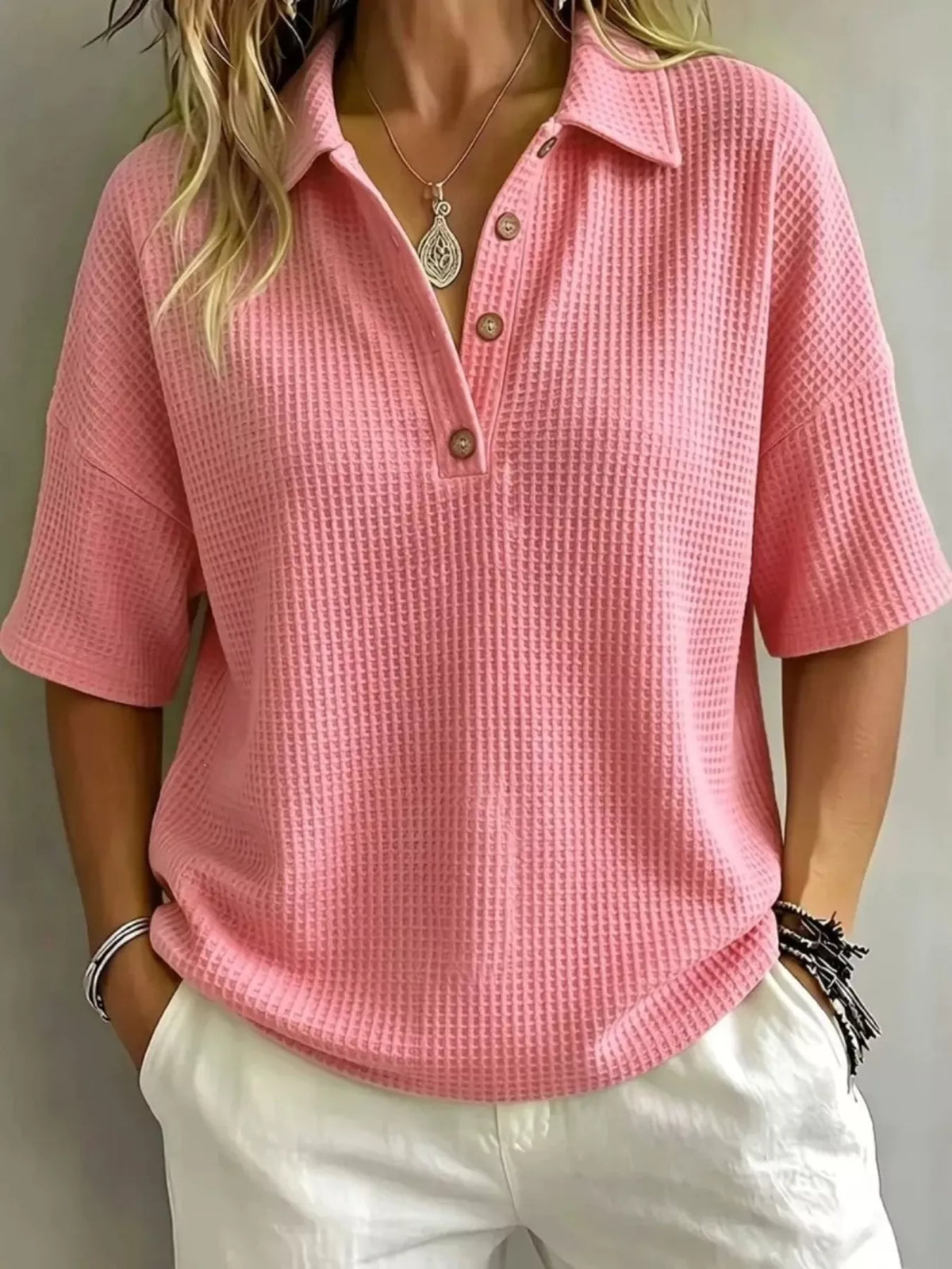 Waffle knit polo top in a bright colourway worn with the collar open