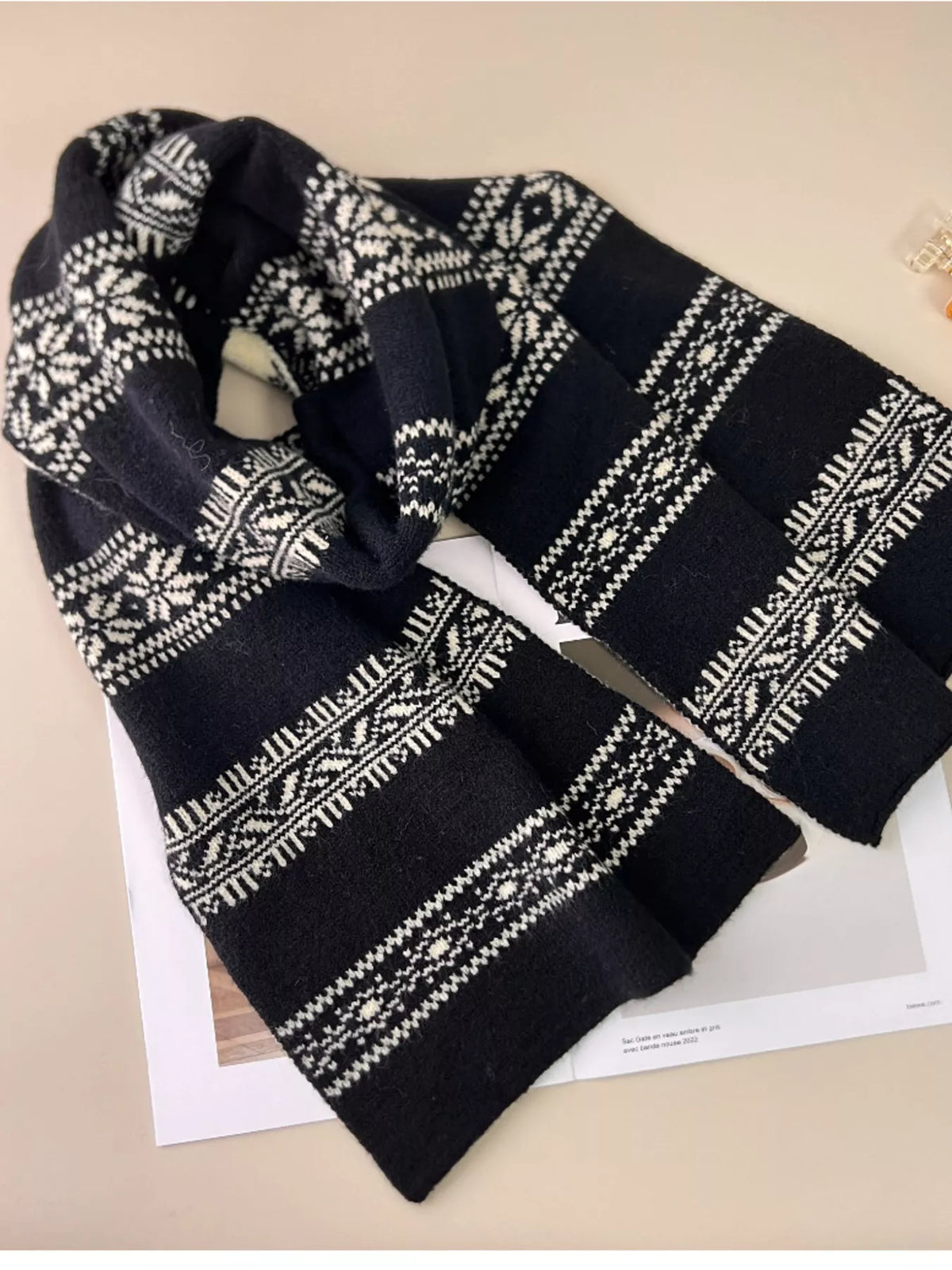 Snowflake pattern scarf shown in natural light