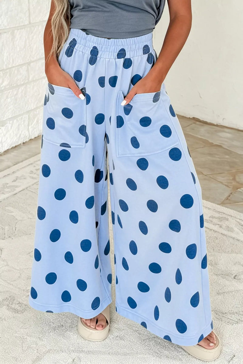 Polka dot wide leg pants in light blue shown on a model
