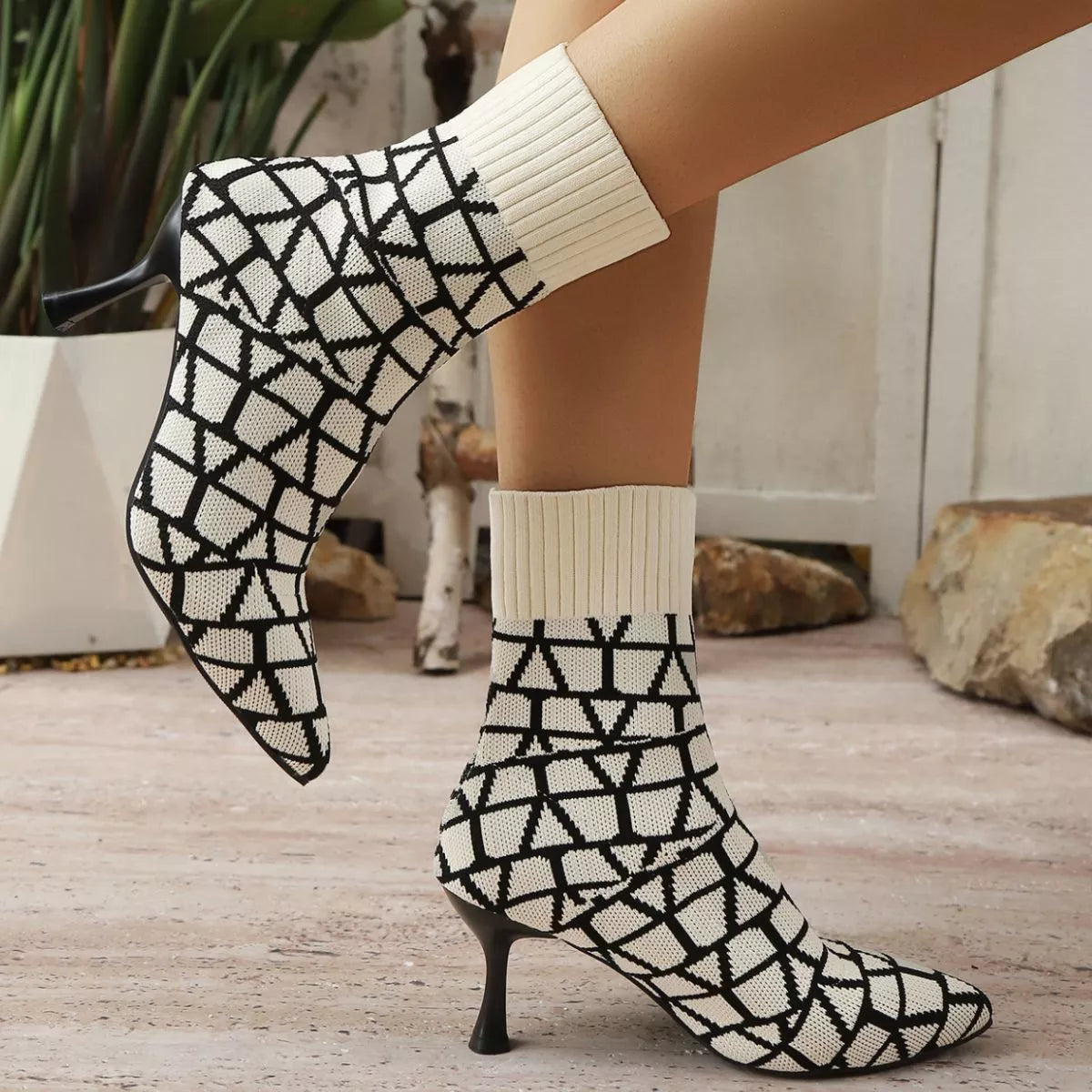 Dark Brown point toe flared heel boots platform and sole detail