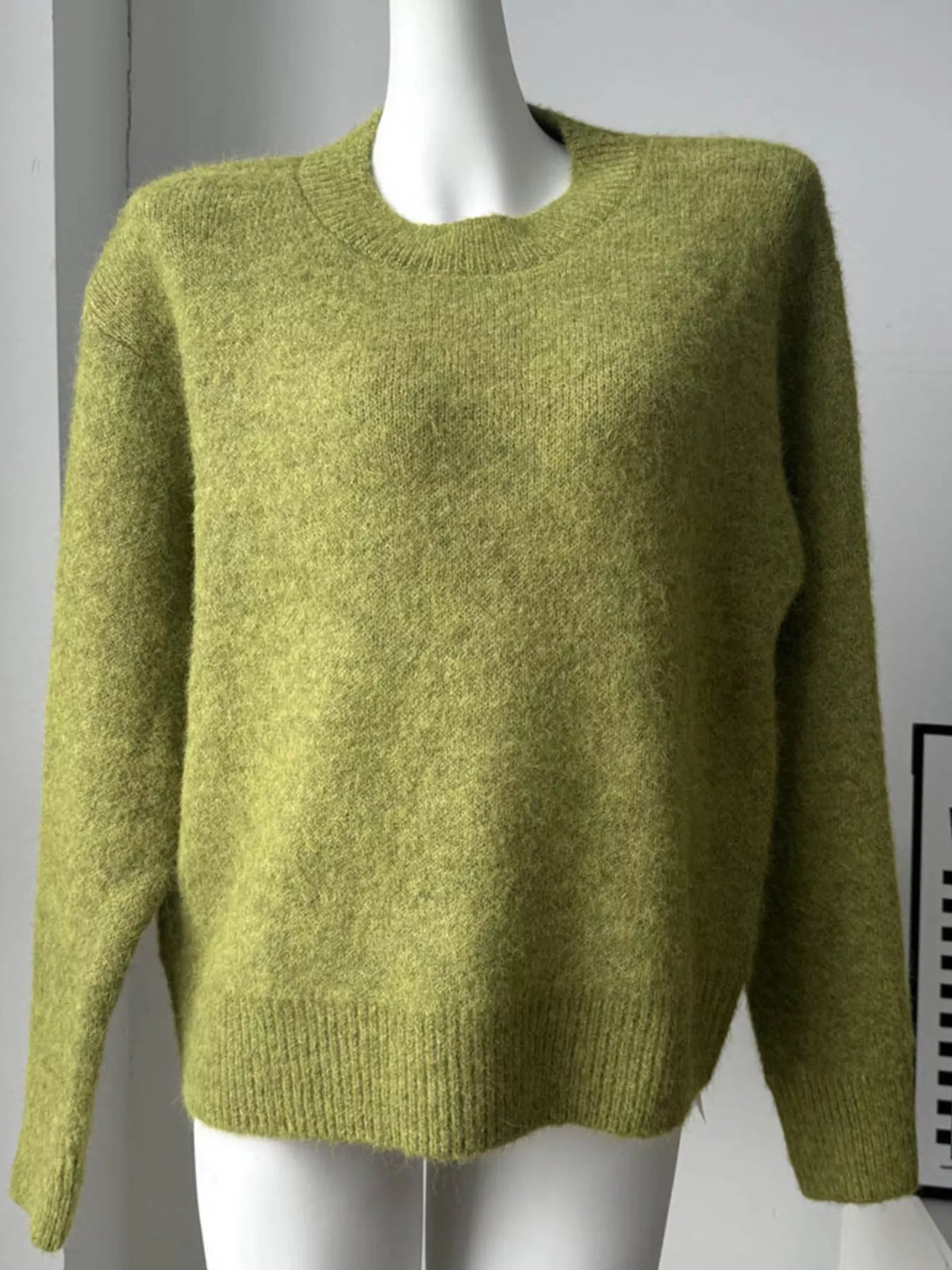 round neck dropped shoulder sweater seated styling view