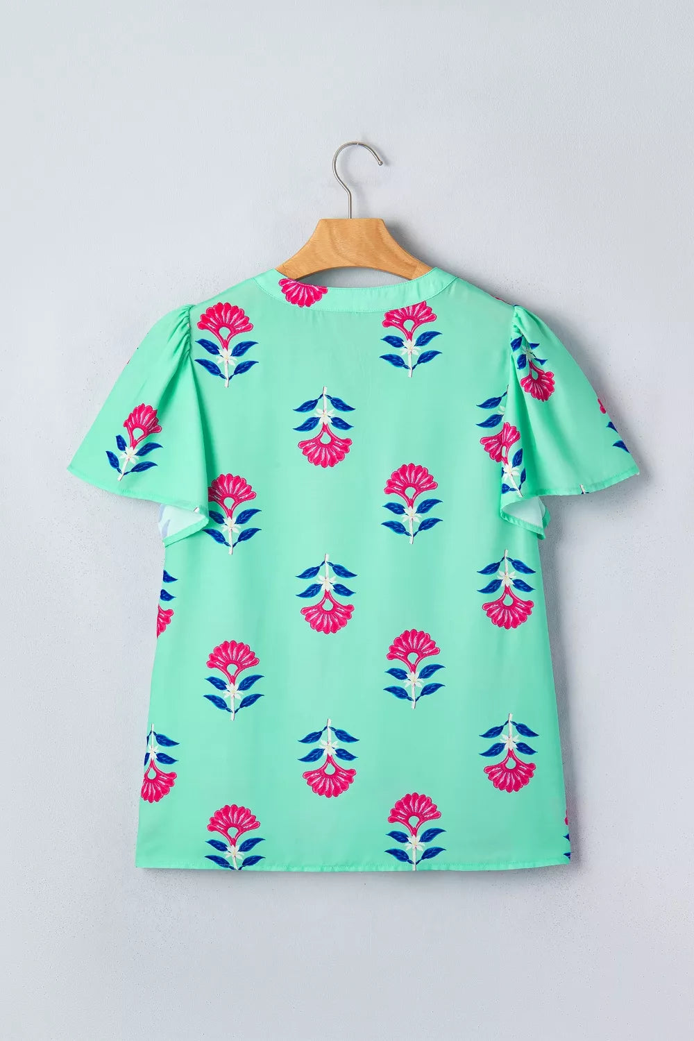 Turquoise floral V neck flutter sleeve blouse full length view