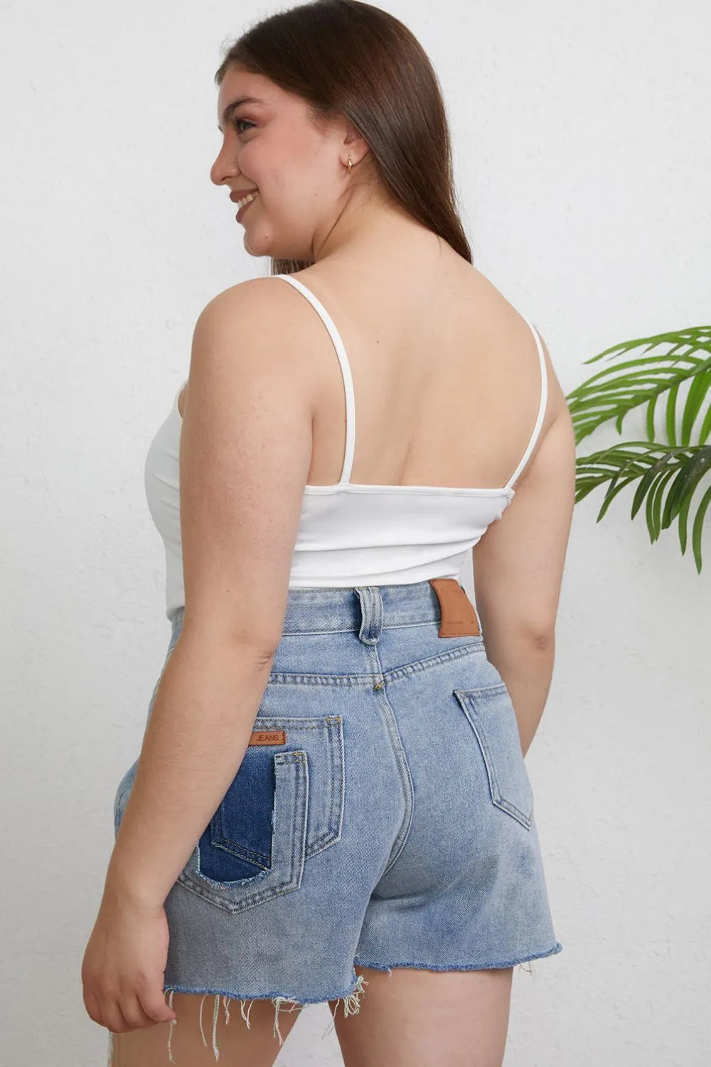 Close up of the round neckline and strap detail