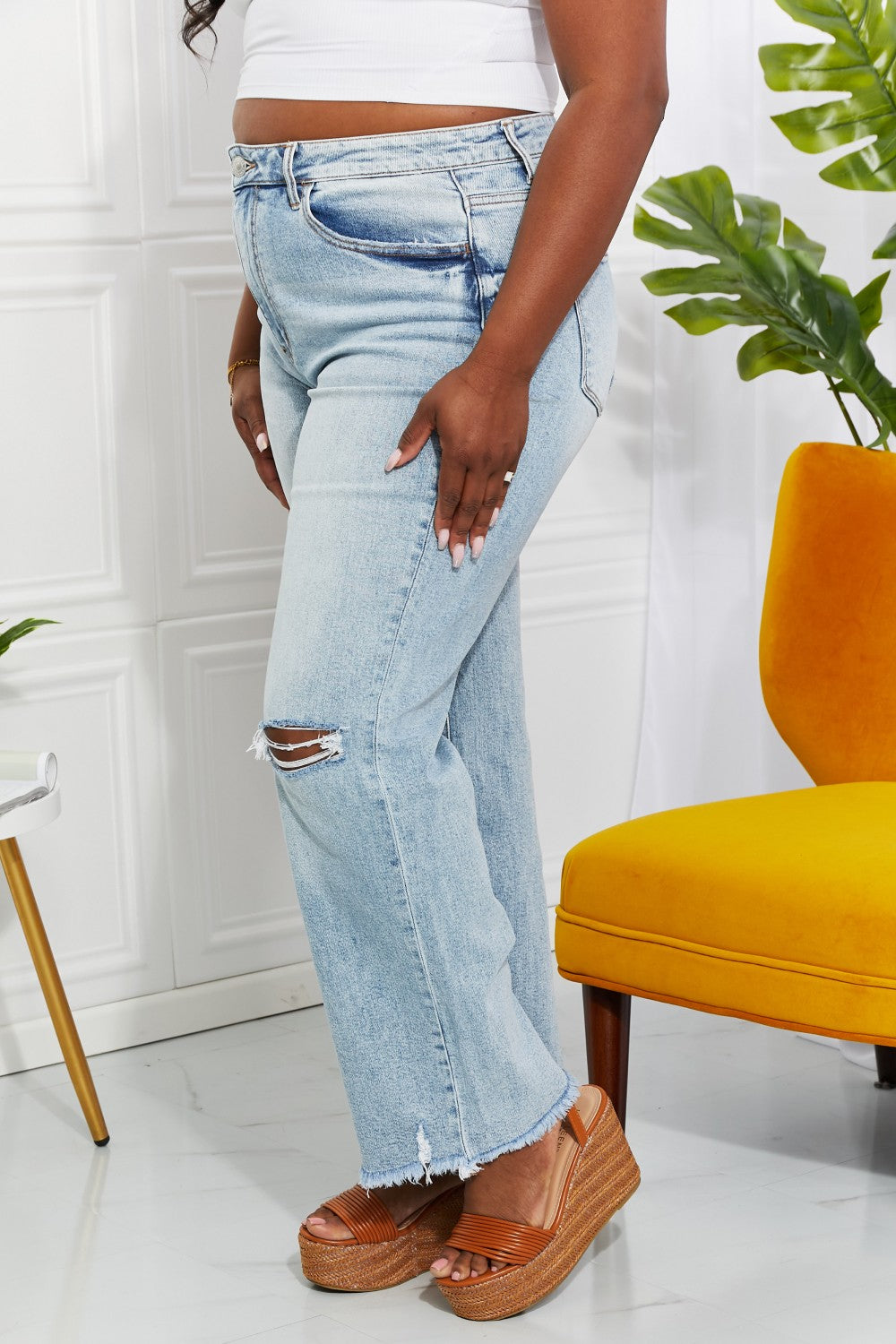 Distressed light wash denim close up