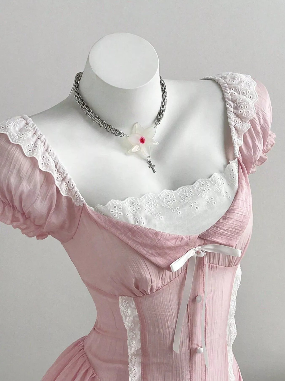 Lace cap sleeve dress shown from the side on a model