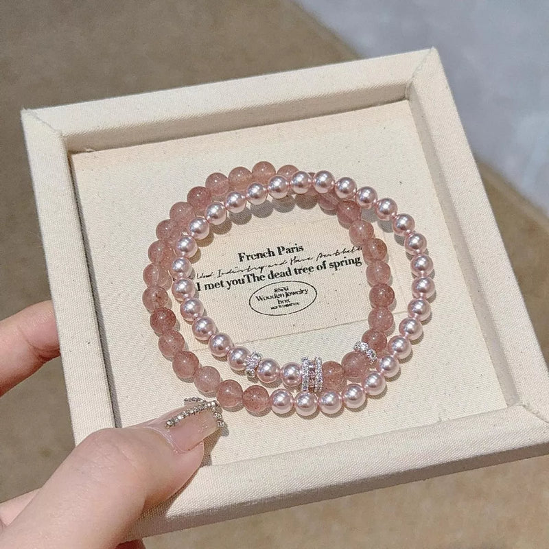 Dusty pink pearl beaded bracelet two piece set flat lay
