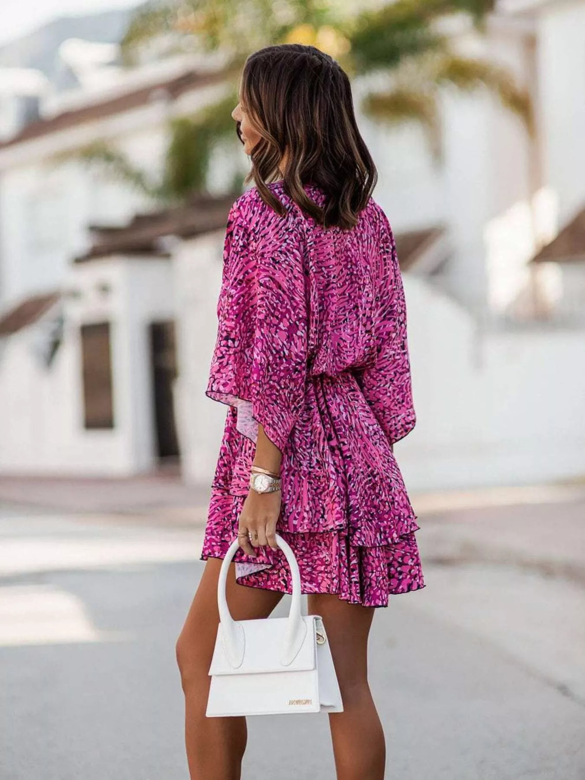 Printed surplice tiered mini dress fabric detail