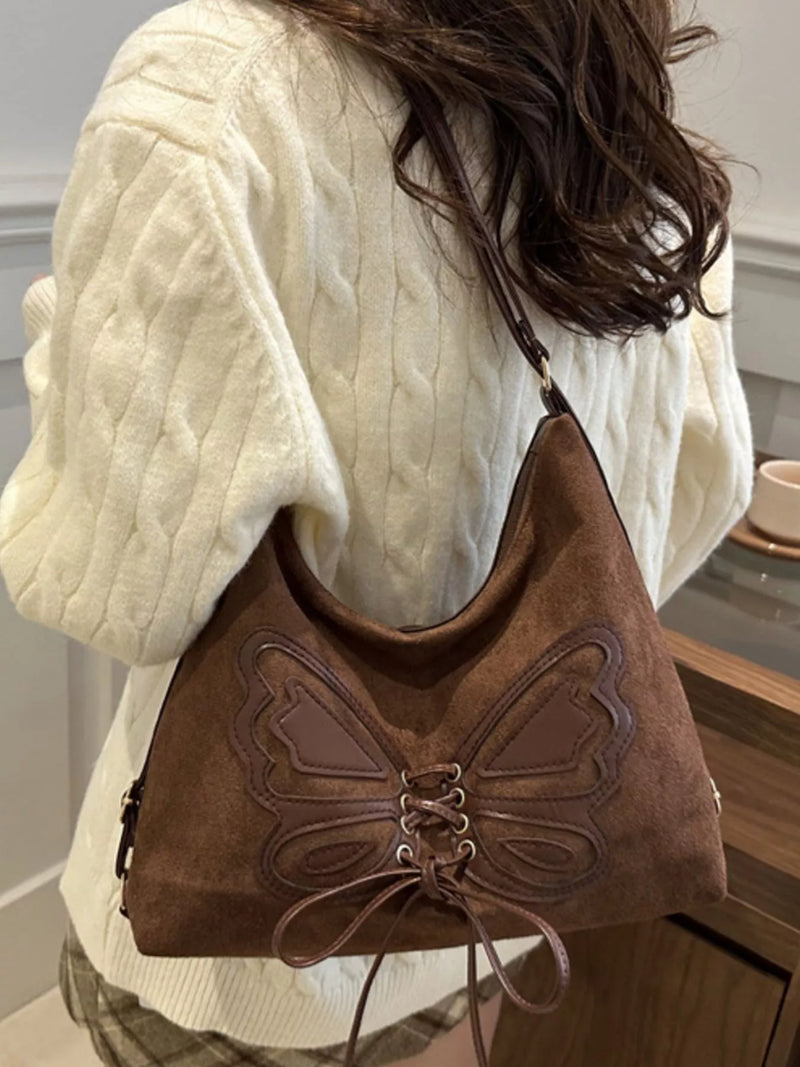 Butterfly lace up suede shoulder bag front view
