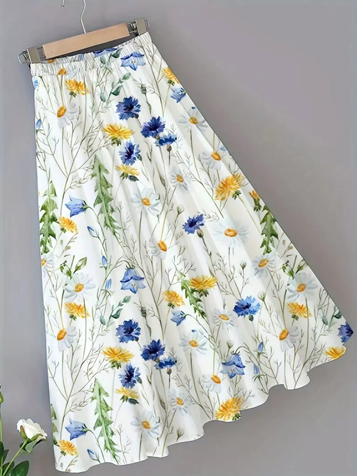 Full length view of the printed midi skirt showing the hem