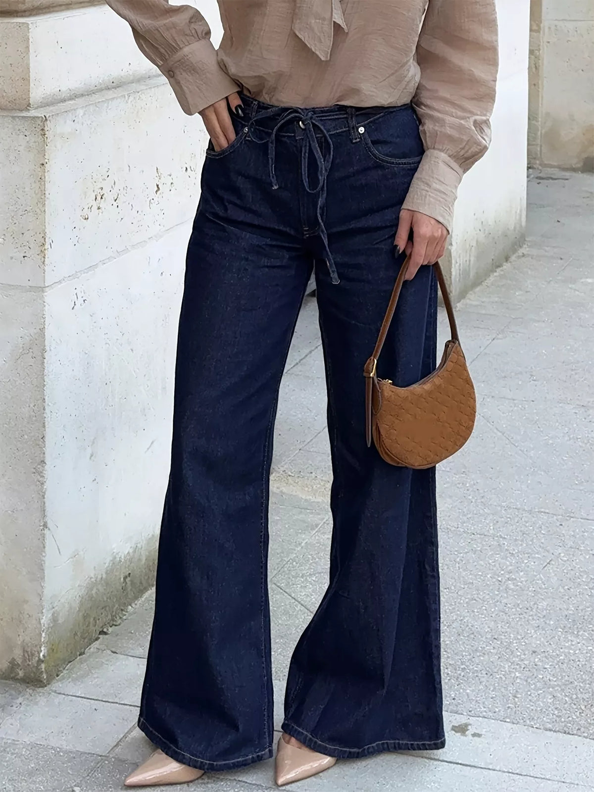 Tied loose fit flare jeans front view