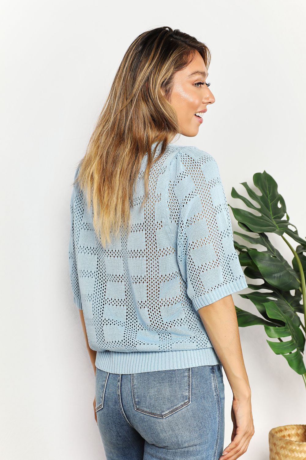Knit top side view showing half sleeve and fit