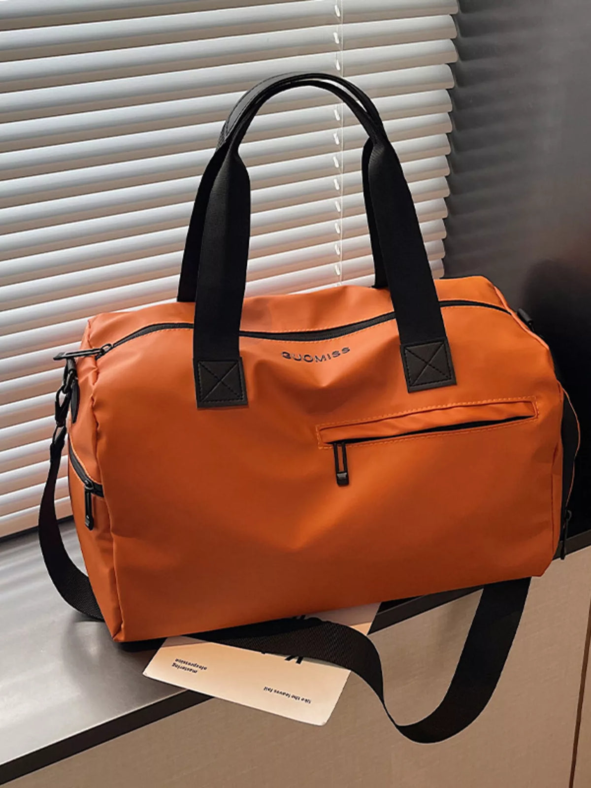 Multi pocket duffel bag front pocket detail