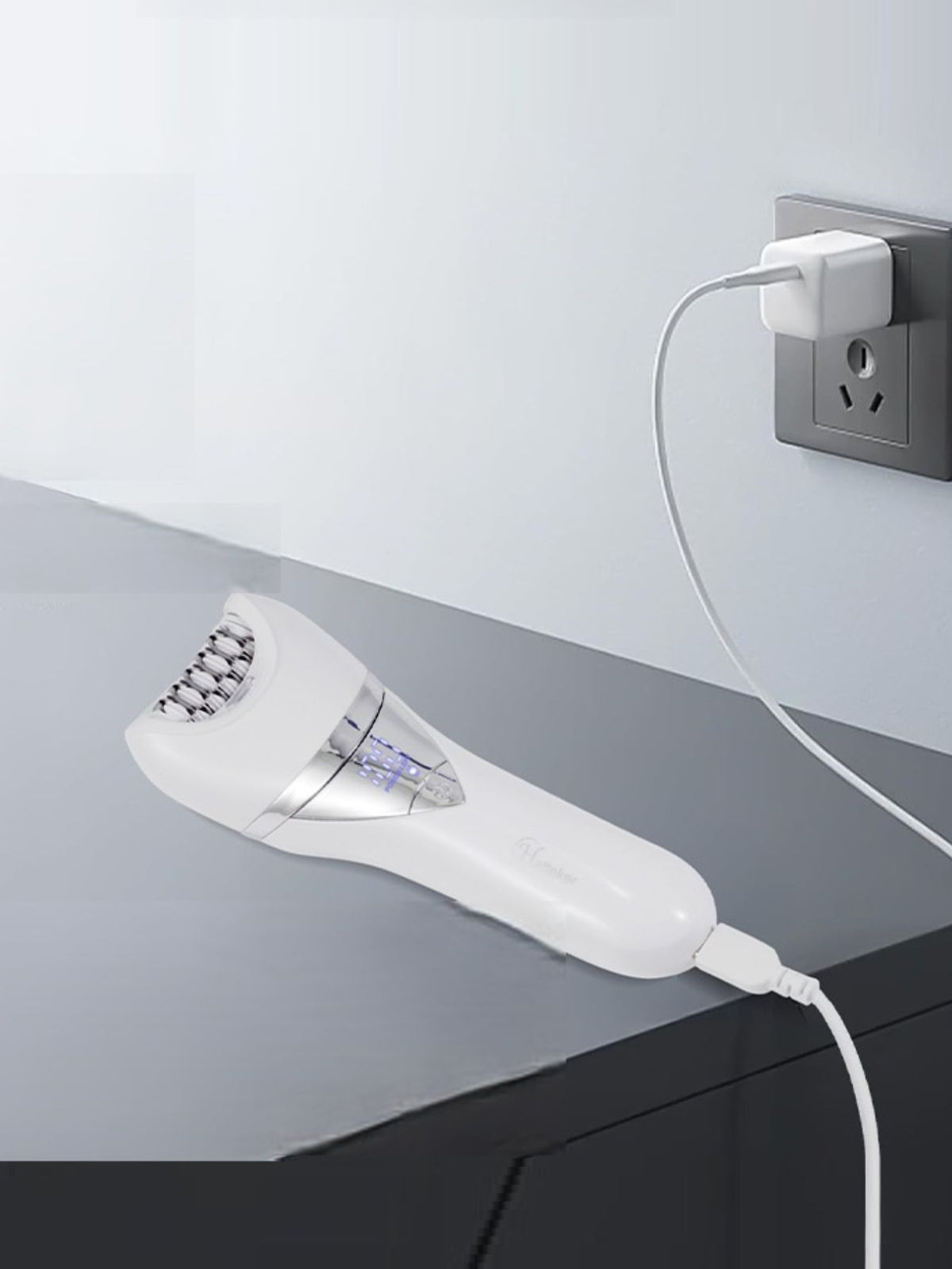 Epilator with attachments laid out