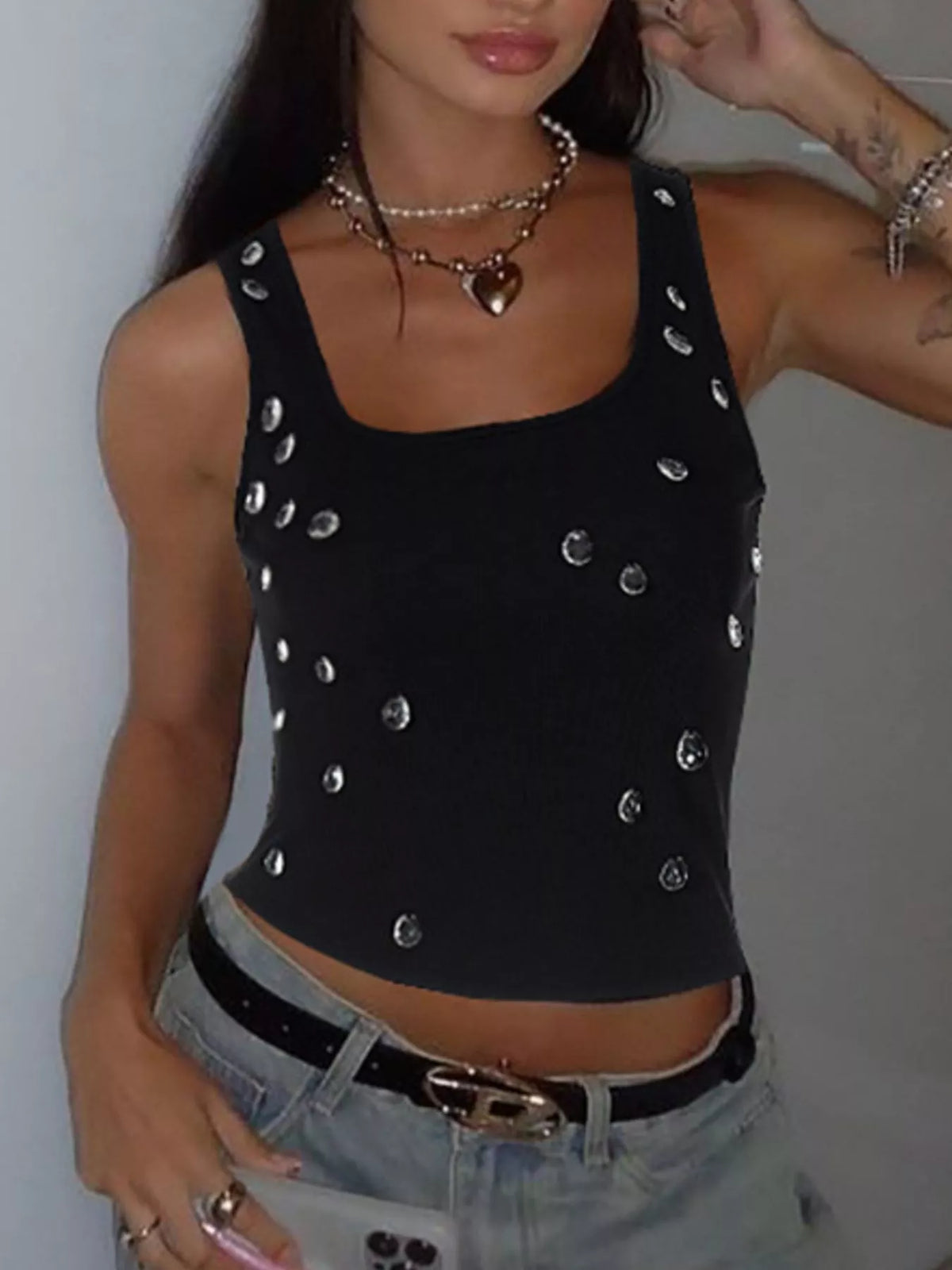 Cropped hem detail on the rhinestone tank top