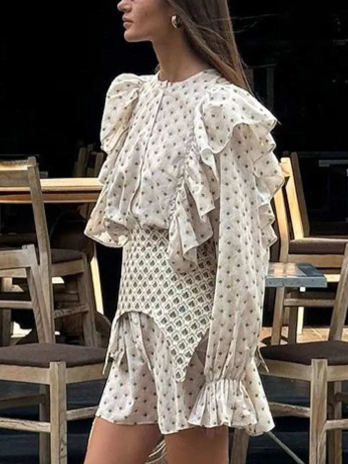 Close view of the floral print on the beige fabric