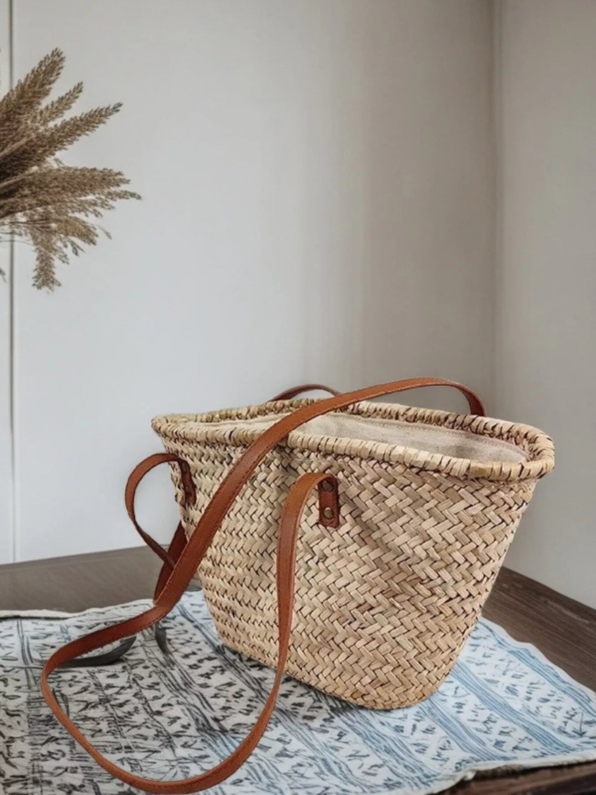 Straw bag strap and hardware detail