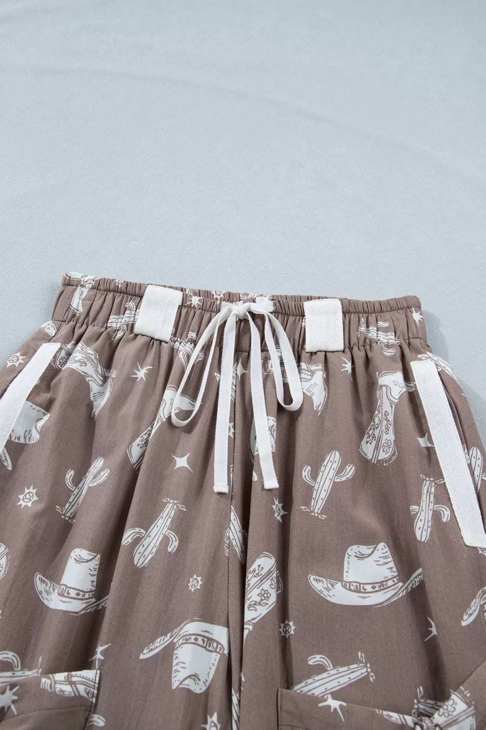 Mocha western cactus print drawstring jogger pants, full length view