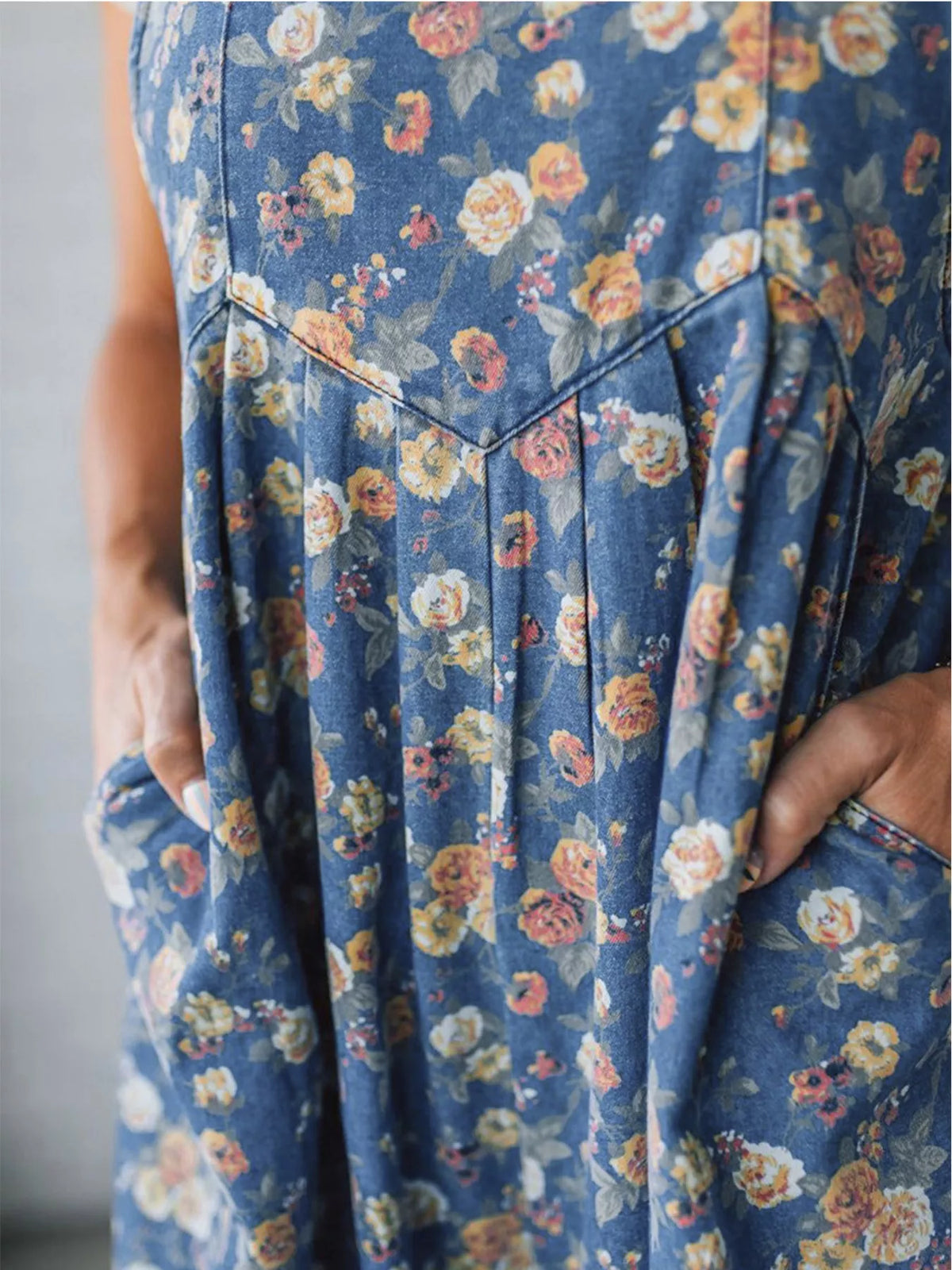 Casual floral overalls seated pose