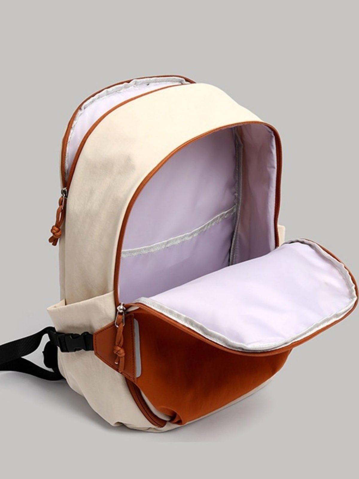 Orange color block nylon backpack top handle close up
