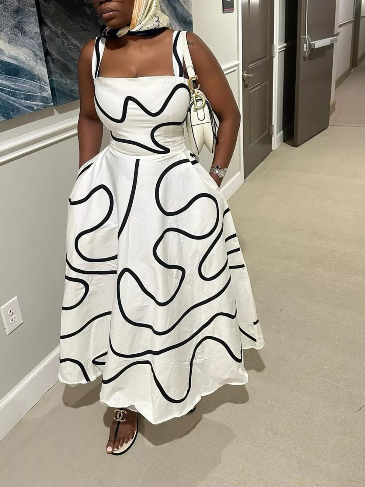 Close view of the square neckline on the printed dress