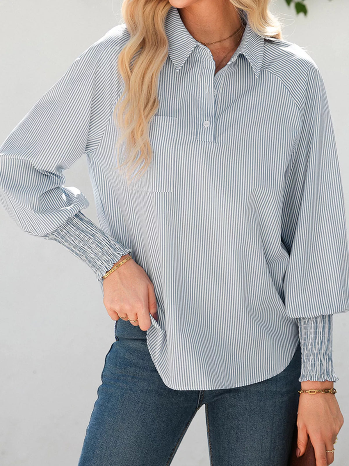 Full length styling shot of the pinstripe blouse