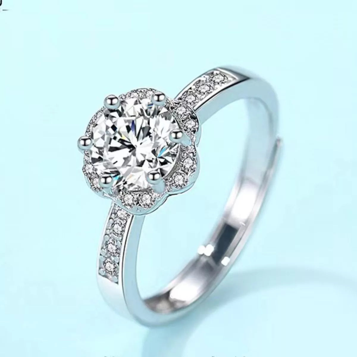 Adjustable silver ring band shown open at the back