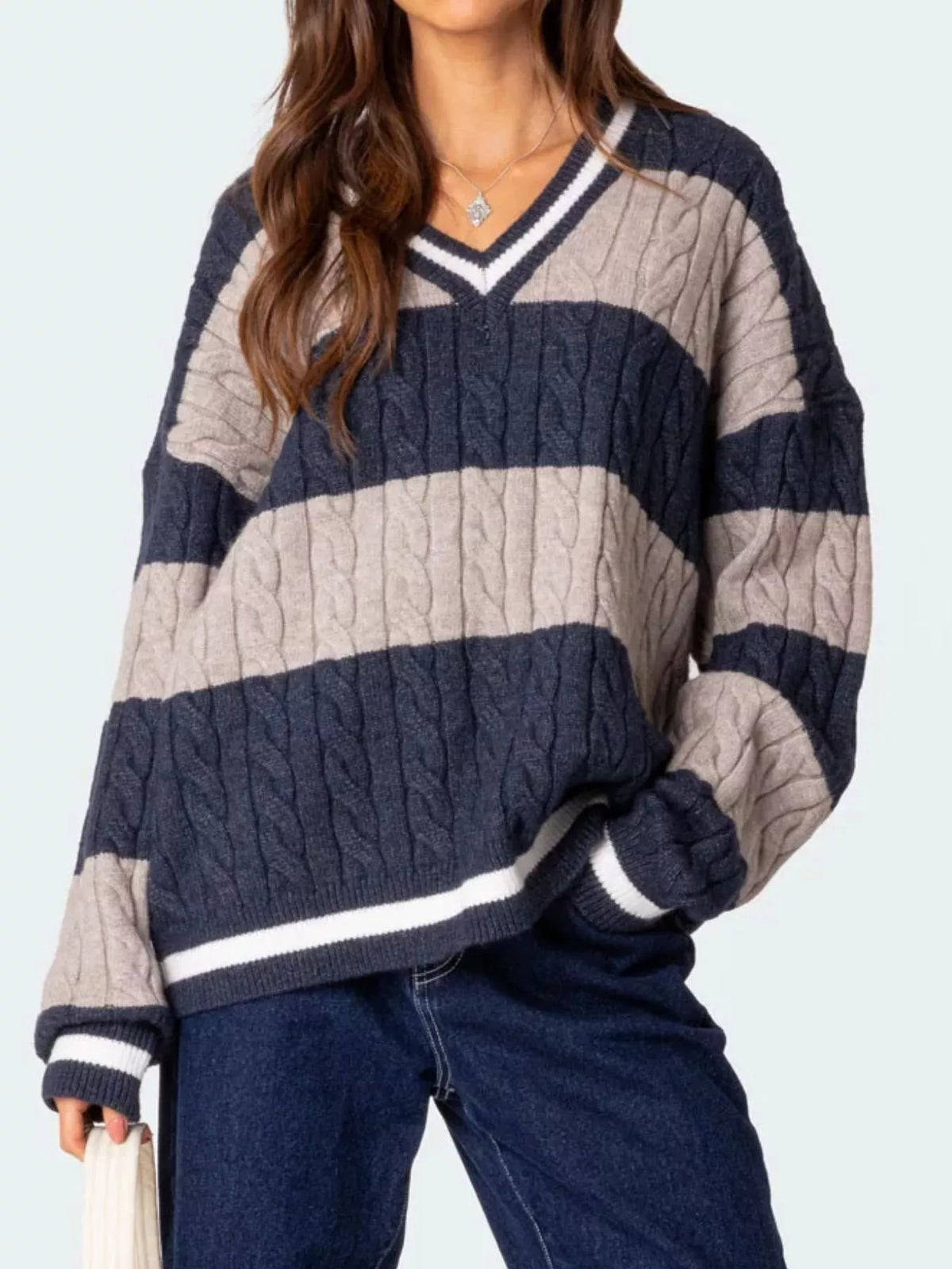 Oversized cable knit sweater styled