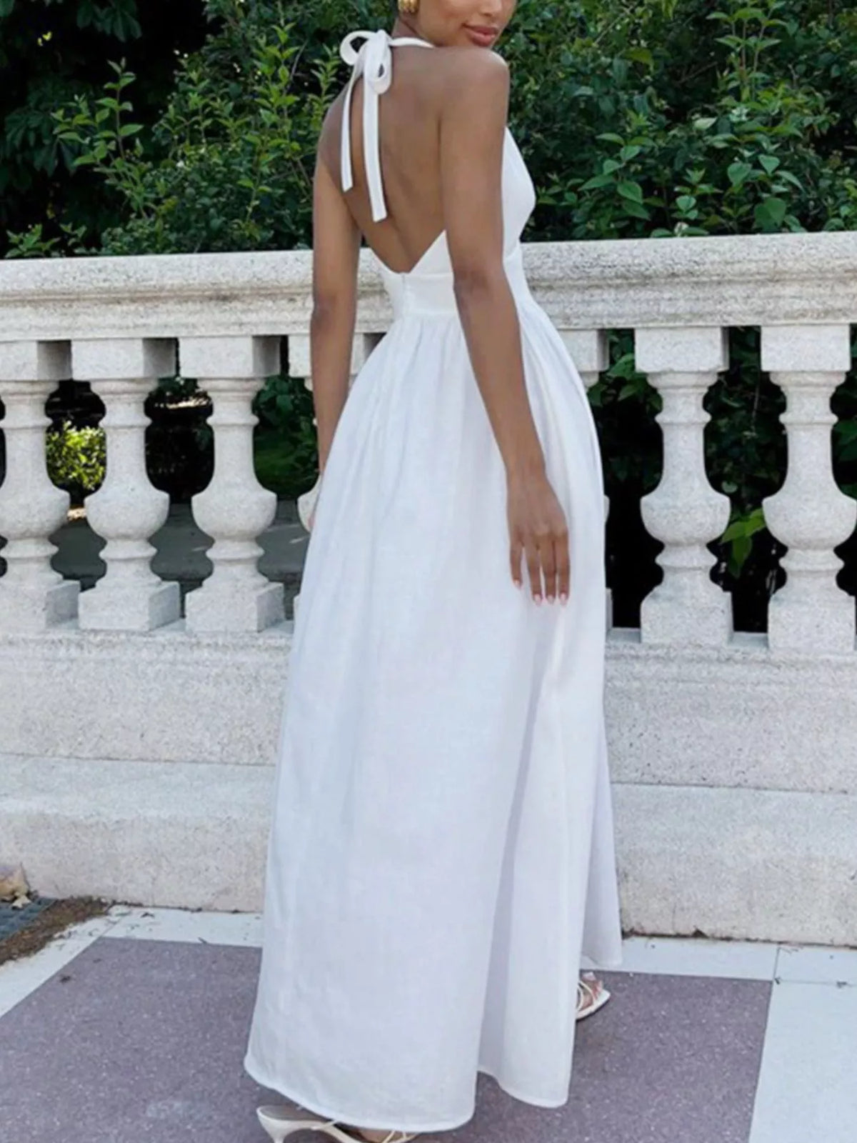 white halter neck tied flowy maxi dress side view