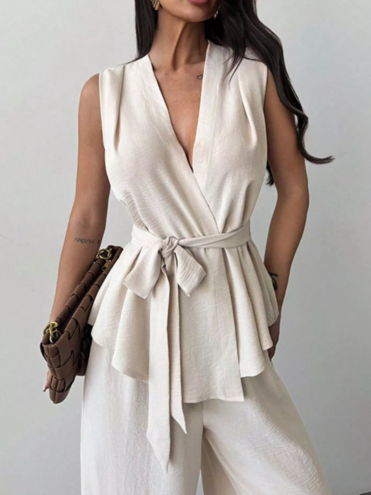 Tied sleeveless top detail on white two piece set