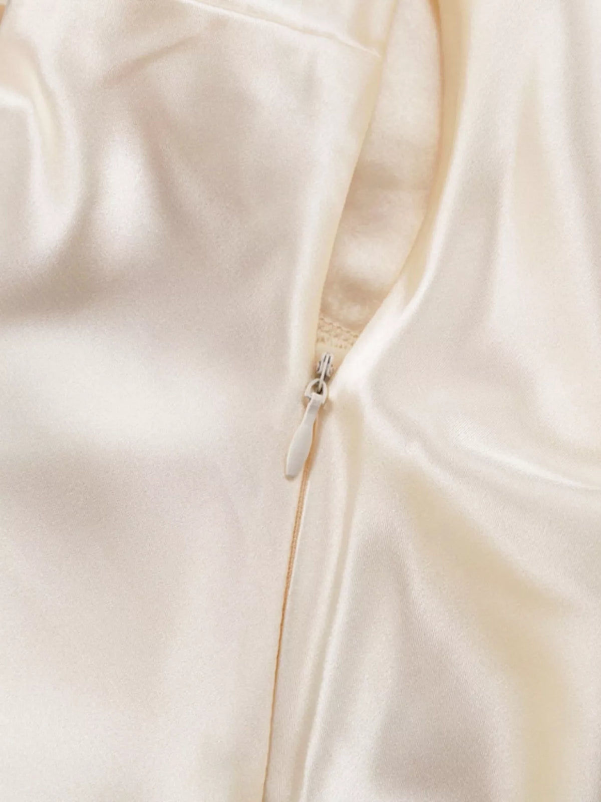 Beige satin dress shown as a wedding guest outfit