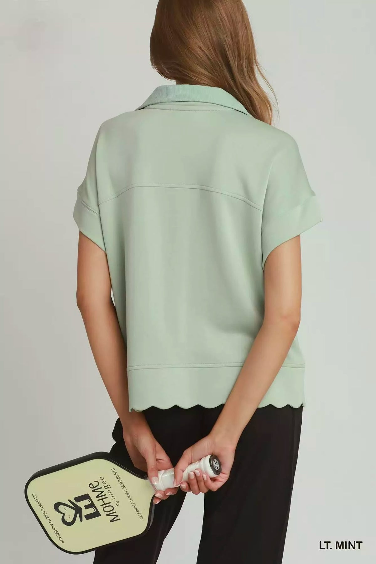 Light mint half zip pullover on model