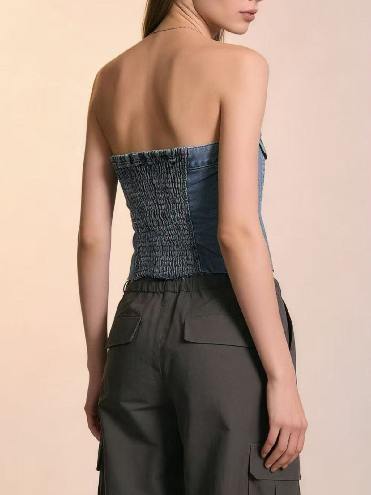 Back view of light blue strapless denim top