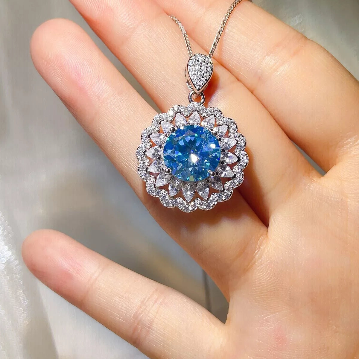 Side view of the blue moissanite pendant showing the stone depth