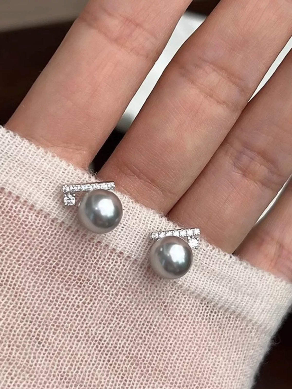 zircon pearl stud earrings styled on model