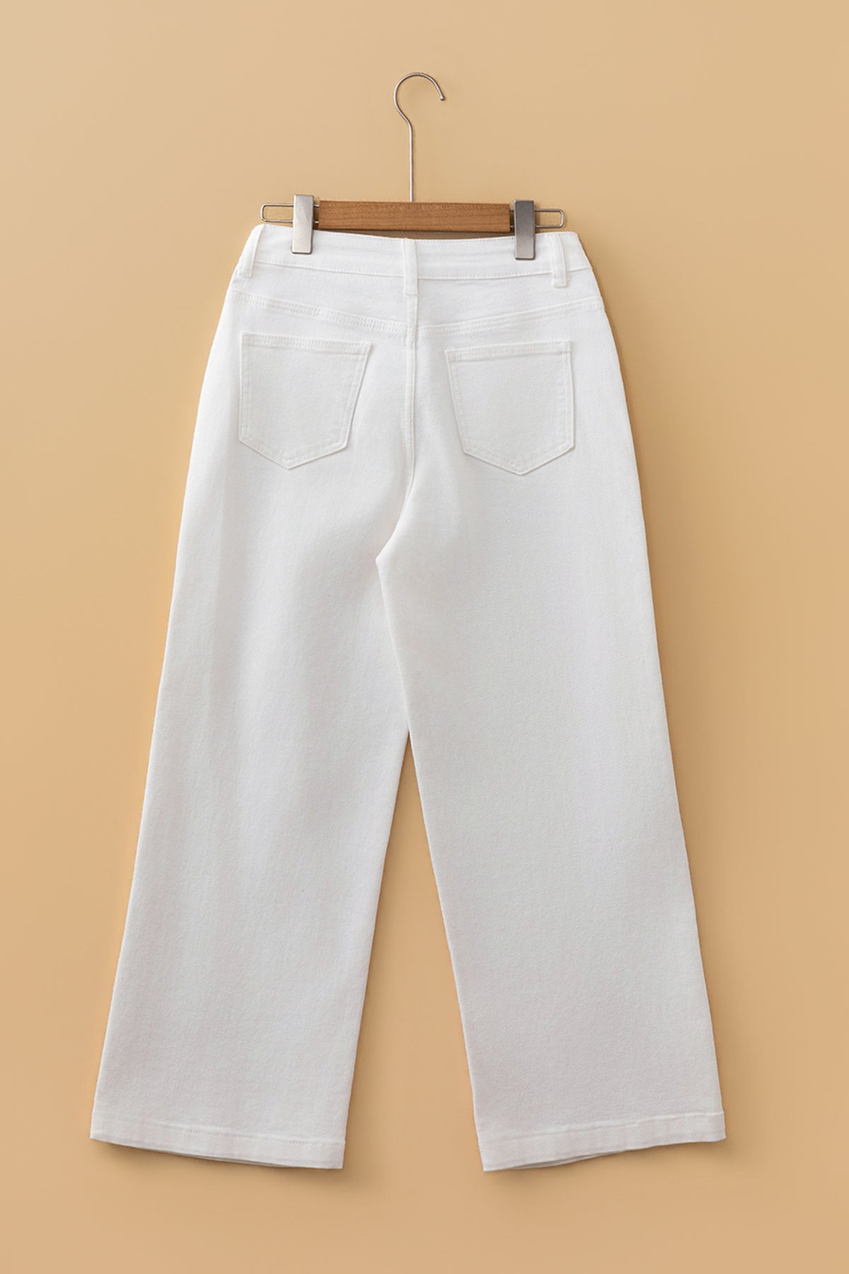 Model wearing white pearl ankle length flare jeans
