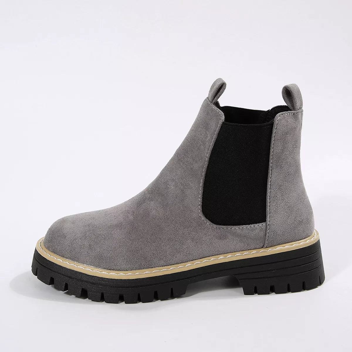 Suede round toe block heel boots pair standing