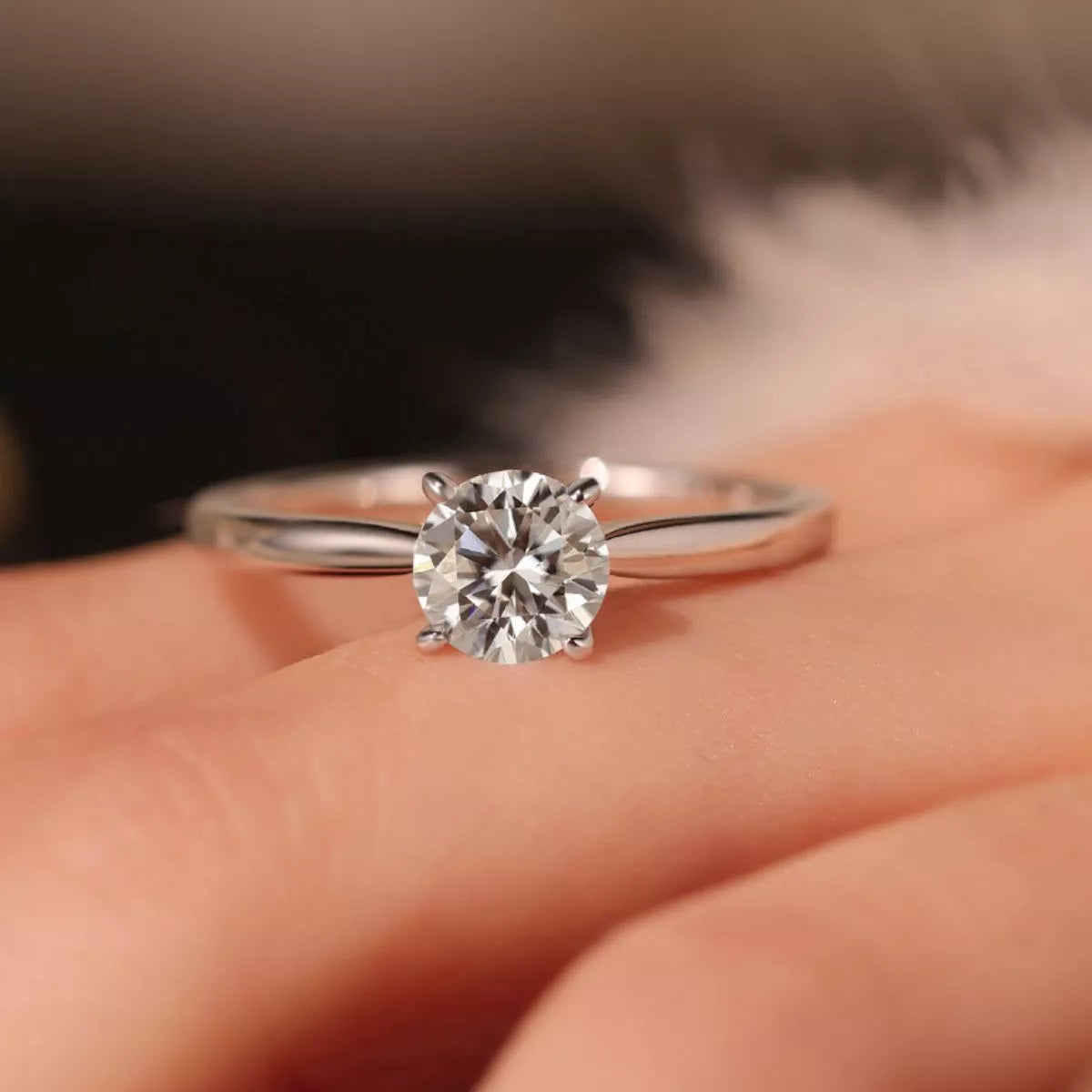Moissanite silver ring shown at an angle to display the setting